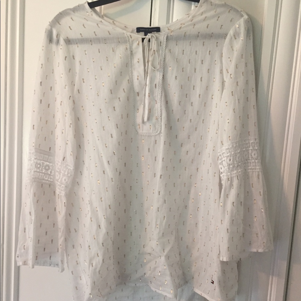 White blouse with gold detailing